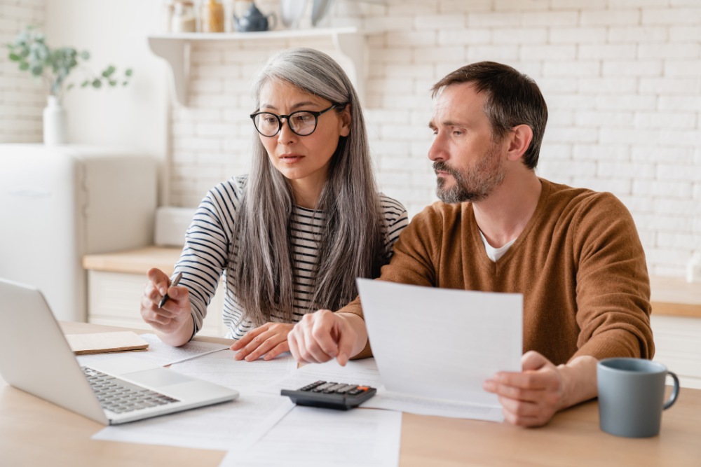 Middle-aged couple-calculating